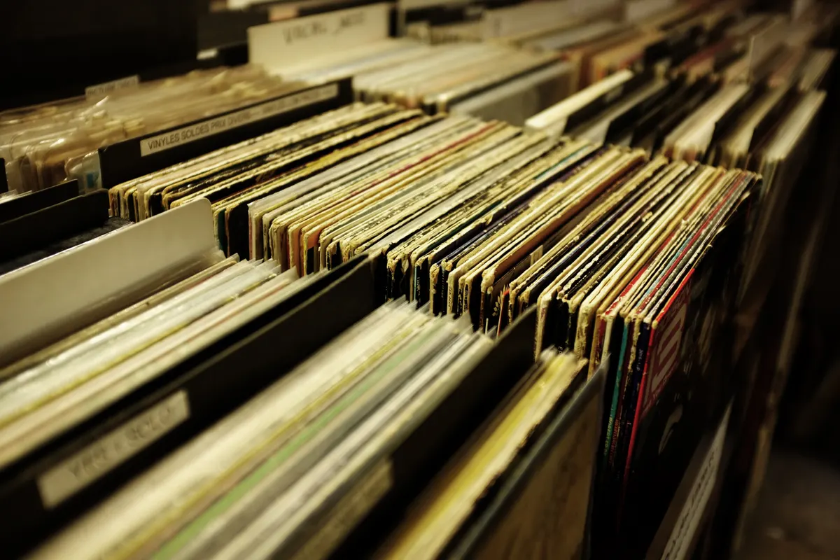 Rows of vinyl records standing in crates with dividers at a record store