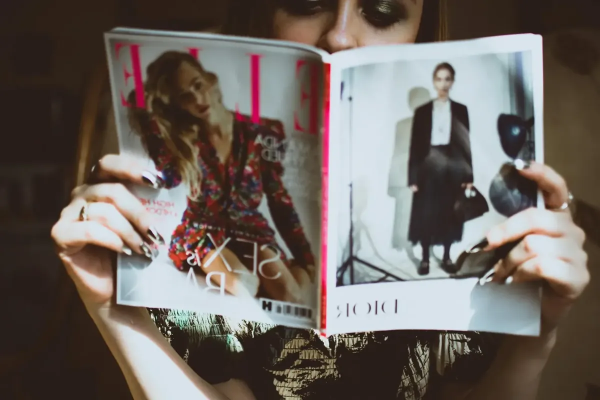 Hands holding an open magazine